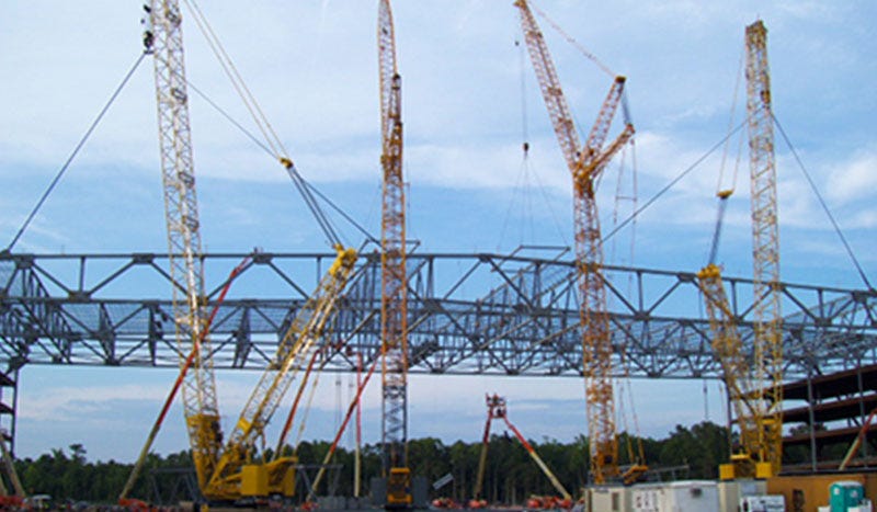 Cranes holding steel bars