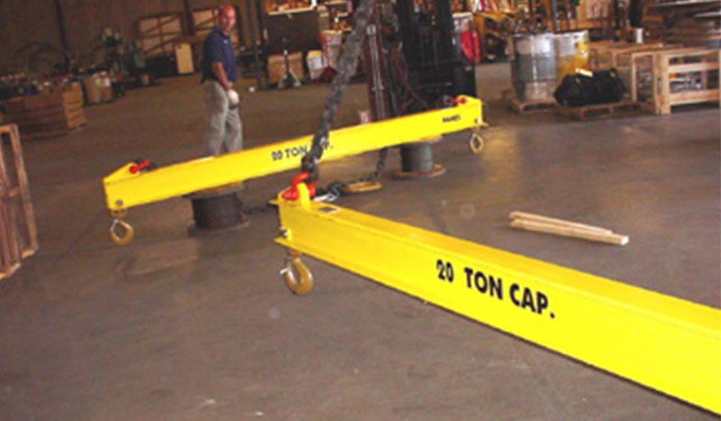 Two 40000 lb yellow spreader beams