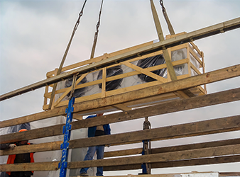 Rigging Setup Securing Wooden Shipping Container with Lifting Chains rigging setup securing wooden shipping container with lifting chains