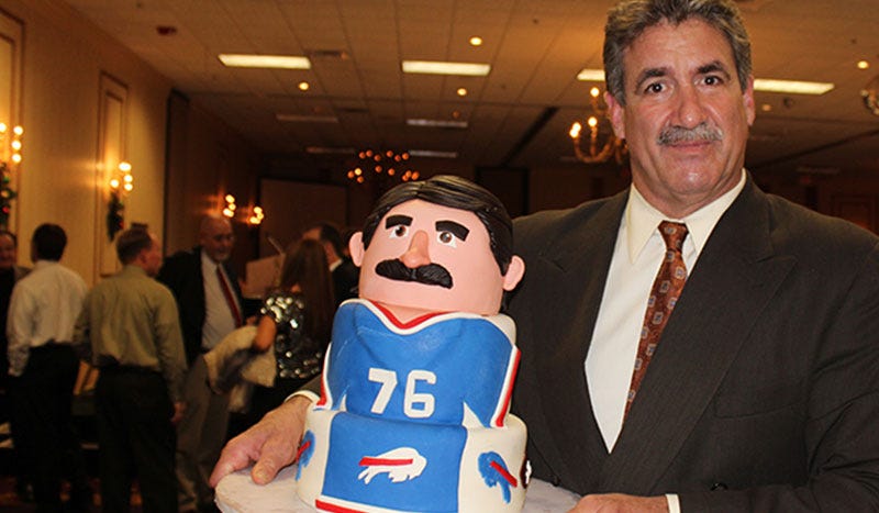 fred smerlas holding buffalo bills cake