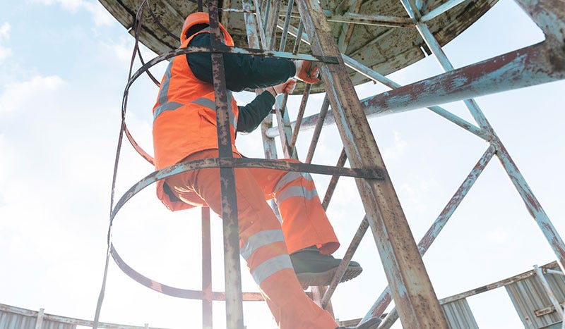 Men on a ladder at jobsite