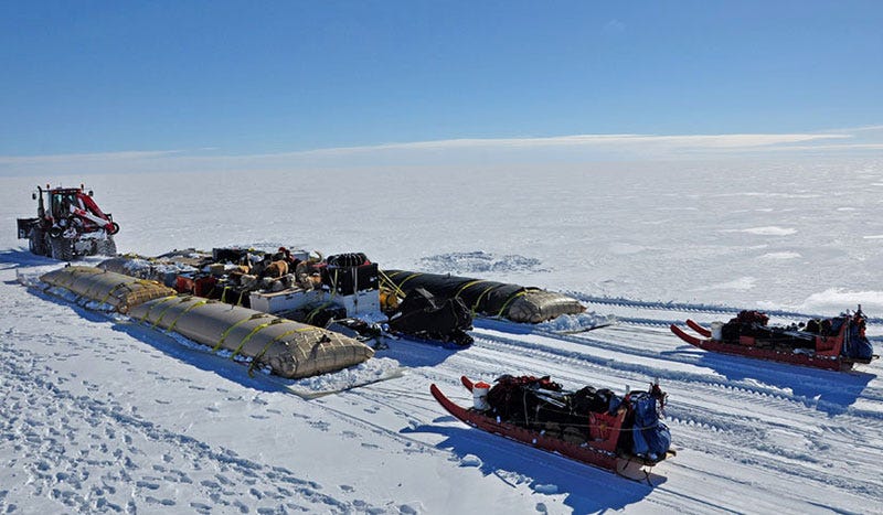 Sleds pulling rigging equipment through snow Sleds pulling rigging equipment through snow
