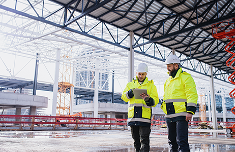 Two Men Reviewing Winter Safety Tips on a Construction Site two men reviewing winter safety tips on a construction site