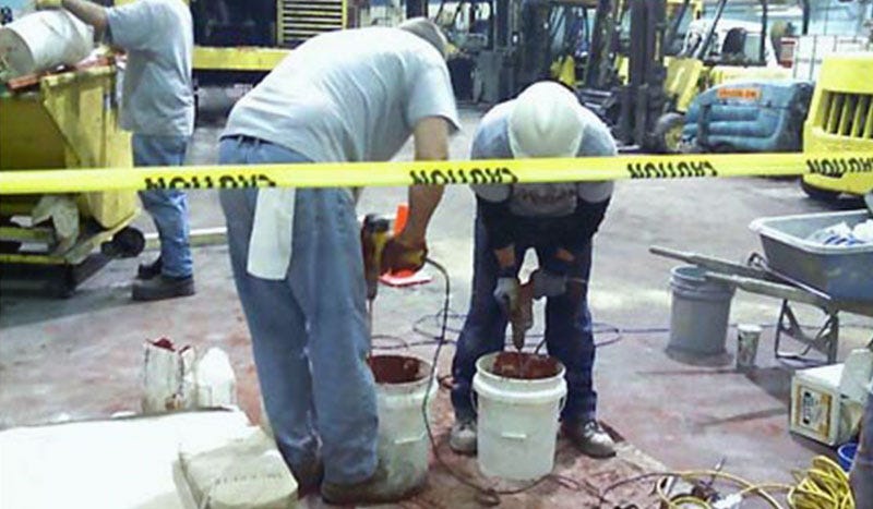 Men on jobsite mixing MG-Krete